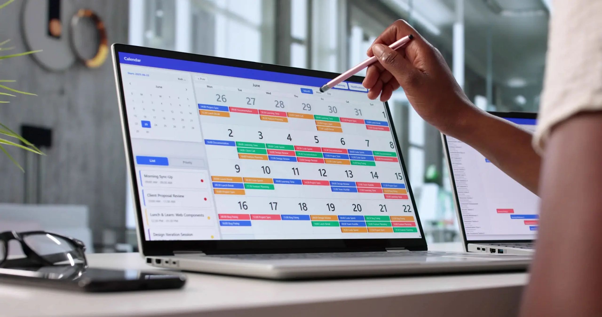Busy calendar schedule on a laptop screen
